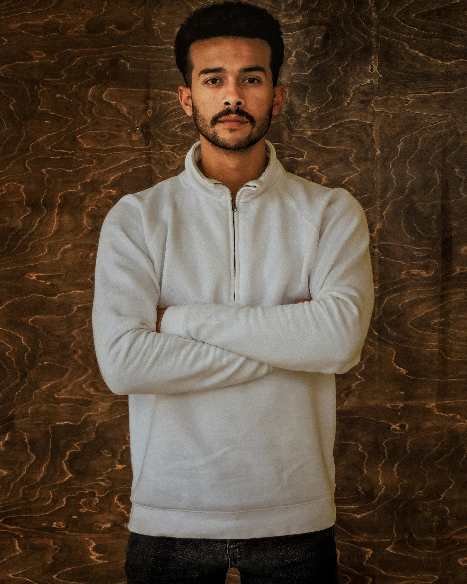 White quarter-zip pullover on a model